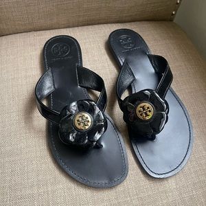 Tory Burch patent leather flower sandals. Don’t think they have ever been worn.